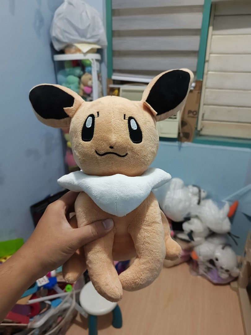 Eevee Pokémon Plush Toy Stuffed Animal (Category: Plushies & Soft Toys) located in Iligan City. Submitted by sneakymagician (Listing ID 1466479161, Image 1). Description: - Official Pokémon Eevee plush toy - Ultra-soft fabric, perfect for hugging - Features cute embroidered eyes and friendly expression - Distinctive black ears and fluffy white neck ruff - Clean, well-maintained, and ready for a new home - Ideal size for bed display or collection.