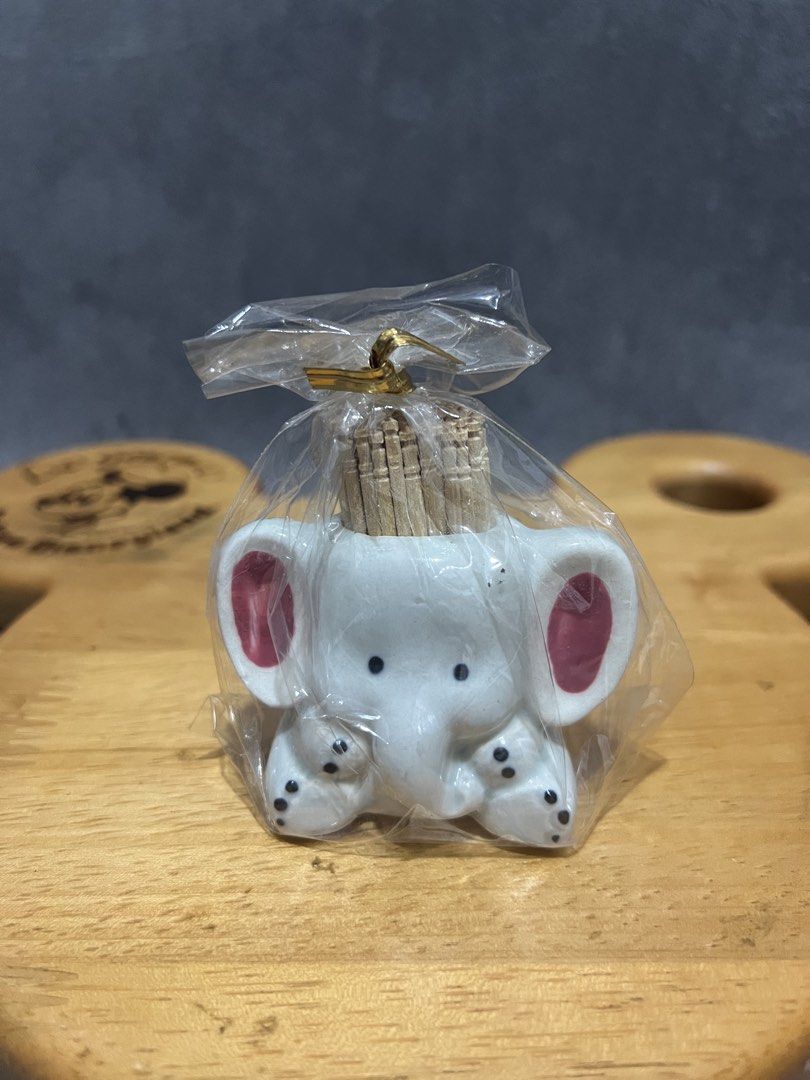 Elephant Toothpick Holder Ceramic Animal Decor (Category: Vintage Collectibles) located in Las Pinas. Submitted by maple0305 (Listing ID 1466410330, Image 1). Description: - Item: Japanese import ceramic white elephant toothpick holder - Design: White body with cute pink ears, black eyes, and spotted feet - Condition: Brand new, unused, and still sealed in original packaging - Inclusions: Comes with a pack of wooden toothpicks - Authenticity: Fea