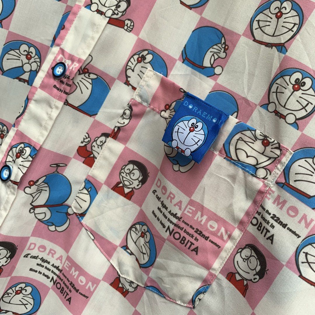 ELF SACK × Doraemon AOP Button Down Polo Pocket Shirt (Category: Tshirts & Polo Shirts ) located in Sindangan. Submitted by holy_thrift (Listing ID 1466476207, Image 3). Description: - ELF SACK × Doraemon AOP Button Down Polo Pocket Shirt - width / 25 - length / 29/30 - no issue - free shipping.