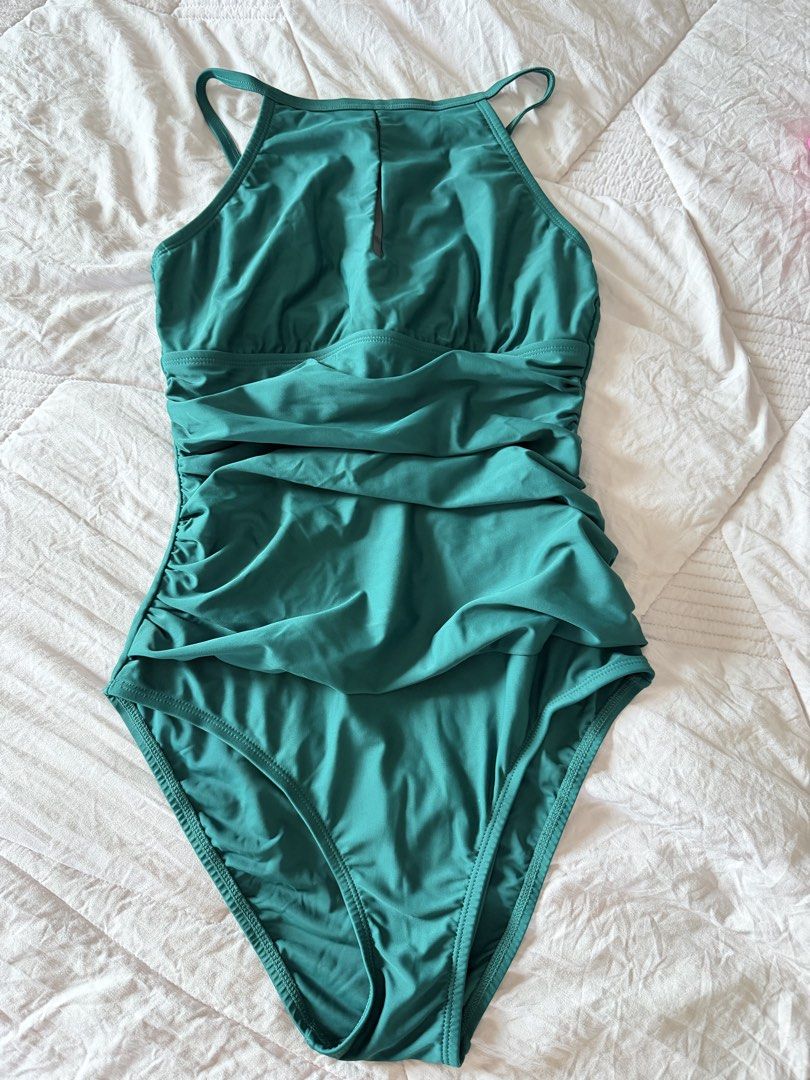 Ellen Tracy One Piece Swimsuit BUNDLE (Category: Bikinis & Swimsuits) located in Taytay. Submitted by gvccloset (Listing ID 1466354058, Image 3). Description: - Brand: Ellen Tracy - Condition: Brand new with tags attached - Size: 6 - Available Colors: Coral red and teal green - Design: High neck style with a stylish keyhole cutout at the chest - Fit: Body-shaping ruched design for a flattering look - Used once.