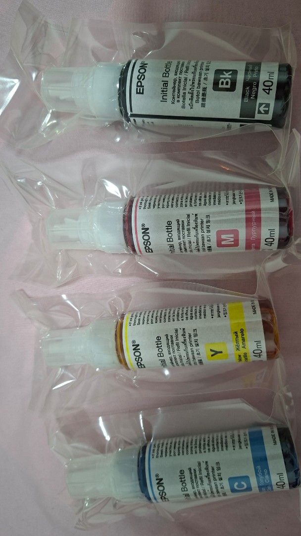 Epson Initial Bottle Ink Set C, Y, M, Bk 40ml (Category: Printers, Scanners & Copiers) located in Manila. Submitted by brutalnaiffur (Listing ID 1466444695, Image 1). Description: - Complete set of 4 Epson initial ink bottles: Cyan, Yellow, Magenta, and Black - Capacity: 40ml per bottle - Condition: Brand new, sealed in individual plastic packaging - Guaranteed never opened or used - Perfect for compatible Epson EcoTank printers.