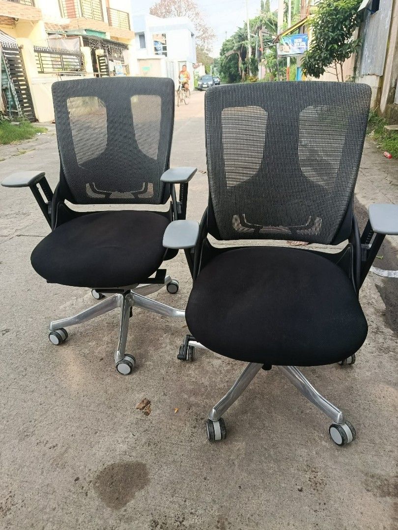 Ergonomic Mesh Office Chair with Adjustable Armrests (Category: Office Furniture & Fixtures) located in Manila. Submitted by lieselrell90474 (Listing ID 1466367637, Image 1). Description: - Ergonomic black mesh back for breathable comfort - Plush padded seat for all-day support - Sturdy silver metal star base with smooth-rolling casters - Convenient flip-up adjustable armrests - 2 matching chairs available (priced individually).