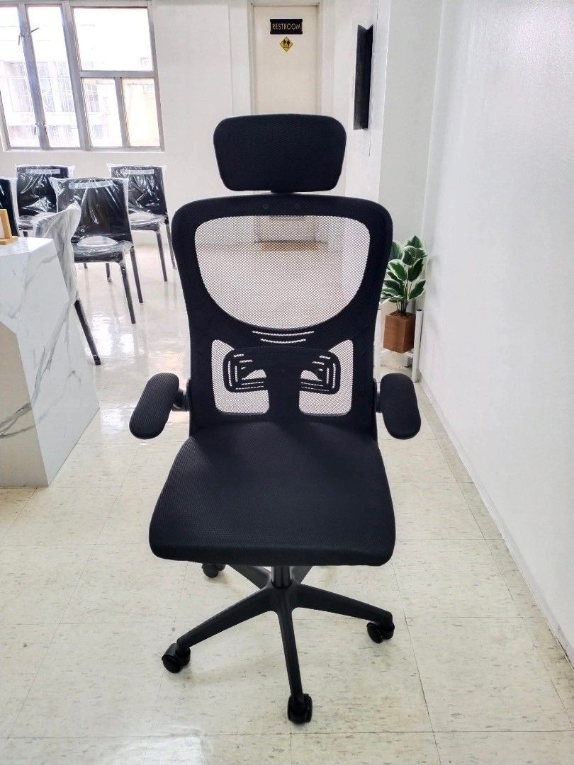 Ergonomic Mesh Office Chair with Adjustable Headrest and Armrests (Category: Office Furniture & Fixtures) located in Manila. Submitted by lieselrell90474 (Listing ID 1466367849, Image 2). Description: - Ergonomic black mesh office chair designed for long hours - Breathable backrest to keep you cool and comfortable - Adjustable headrest and padded armrests for solid support - Smooth-rolling casters on a sturdy five-star base - Multiple units avail