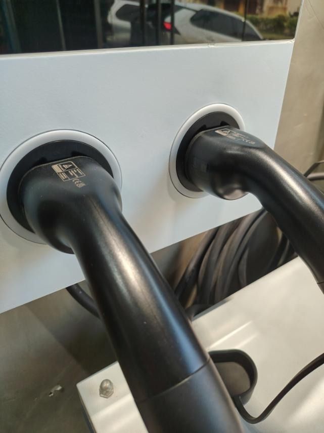 EV CHARGER OCPP READY 44KW (Category: Everything Else Others) located in Mandaluyong City. Submitted by jazhruiz (Listing ID 1466439795, Image 3). Description: - Brand: ENERXIA - Model/Type: OCPP Ready 44KW EV Charger - Design: Wall-mounted dual port system with black and white finish - Features: Integrated display screen and RFID/card reader area - Cables: Dual heavy-duty black charging cables included - Condition: Brand new, clean, and ready fo