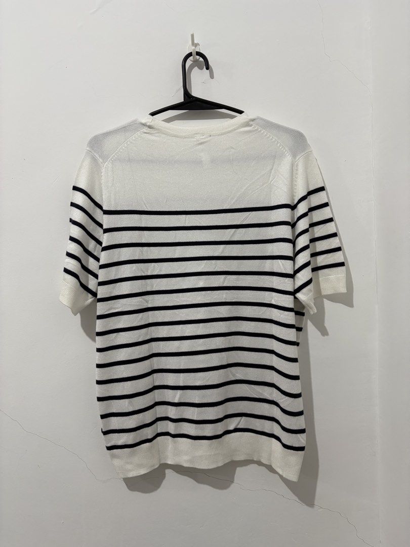Everme Knit Tops Bundle (White Stripe & Solid Black) (Category: Sleeveless) located in Manila. Submitted by coolphoenix_f1e702 (Listing ID 1466444916, Image 2). Description: - Brand: Everme - Size: L - Quantity: 2 knit tops - Top 1: White with black horizontal stripes, short sleeves, crew neck - Top 2: Solid black, dropped shoulders, relaxed fit - Details: Ribbed hem and cuffs on both - Material: Soft knit, comfortable for daily wear - Versatile: