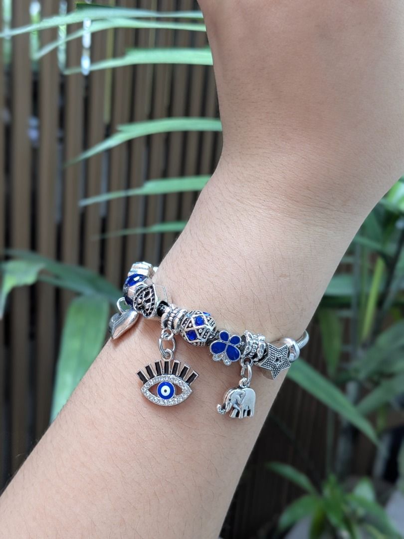 Evil Eye Silvertone Charm Bracelet (Category: Bracelets) located in Quezon City. Submitted by nnncorner (Listing ID 1466424245, Image 2). Description: Evil Eye Silvertone Charm Bracelet New and velvet box included Fits 17-24 cm wrist Perfect for gifting Hypoallergenic Made in Korea Not lightweight Worn to show how it looks. 890.