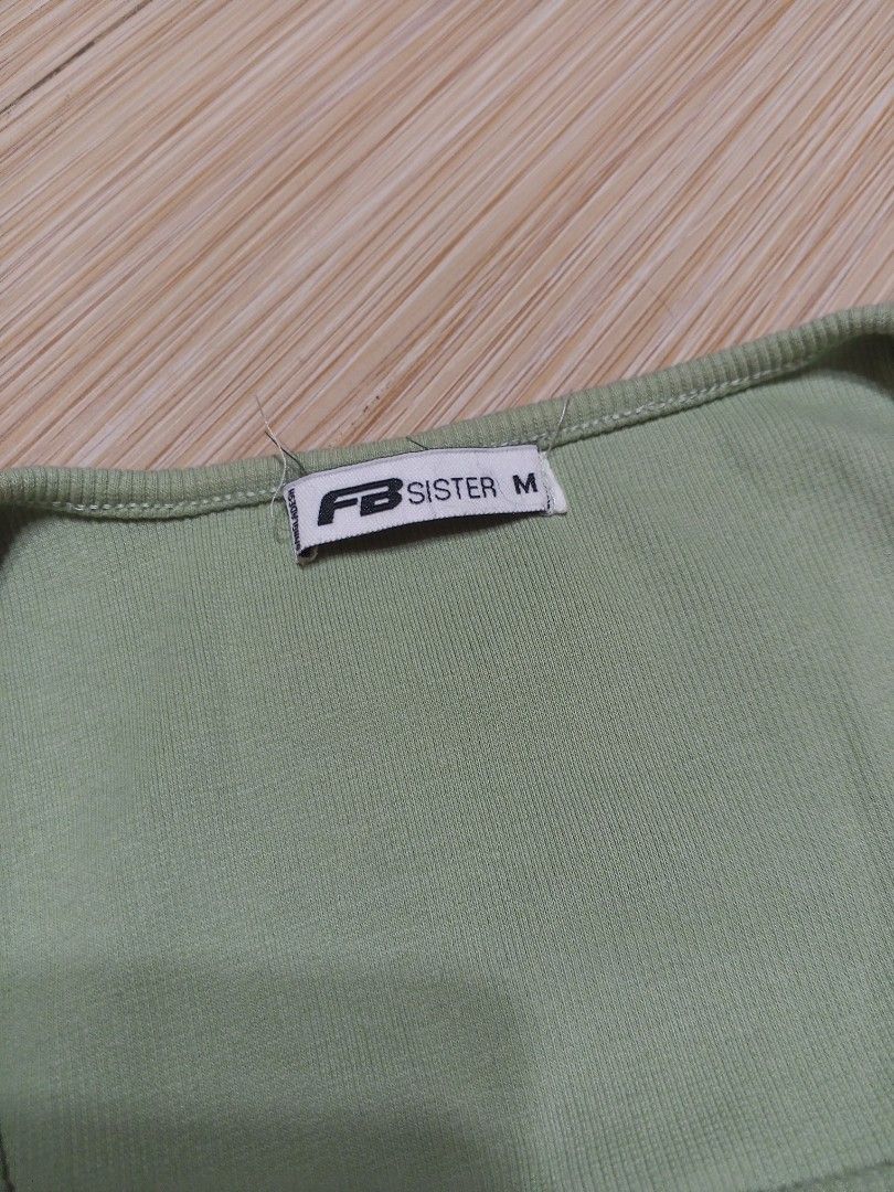 FB Sister Green Ribbed Ruched Crop Top (Category: Others Tops) located in Santa Cruz. Submitted by jldeclutter (Listing ID 1466497321, Image 2). Description: - Size: M on tag but fits me perfectly (size small) Green, stretchy ribbed fabric, square neckline, and adjustable side drawstrings - Condition: Clean and ready to wear Loc: Sta. Cruz, Laguna MOP: GCash MOD: JnT.