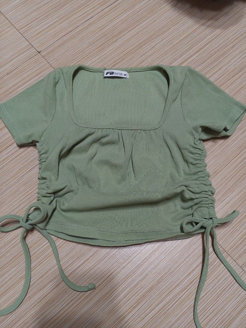 FB Sister Green Ribbed Ruched Crop Top (Category: Others Tops) located in Santa Cruz. Submitted by jldeclutter (Listing ID 1466497321, Image 1). Description: - Size: M on tag but fits me perfectly (size small) Green, stretchy ribbed fabric, square neckline, and adjustable side drawstrings - Condition: Clean and ready to wear Loc: Sta. Cruz, Laguna MOP: GCash MOD: JnT.