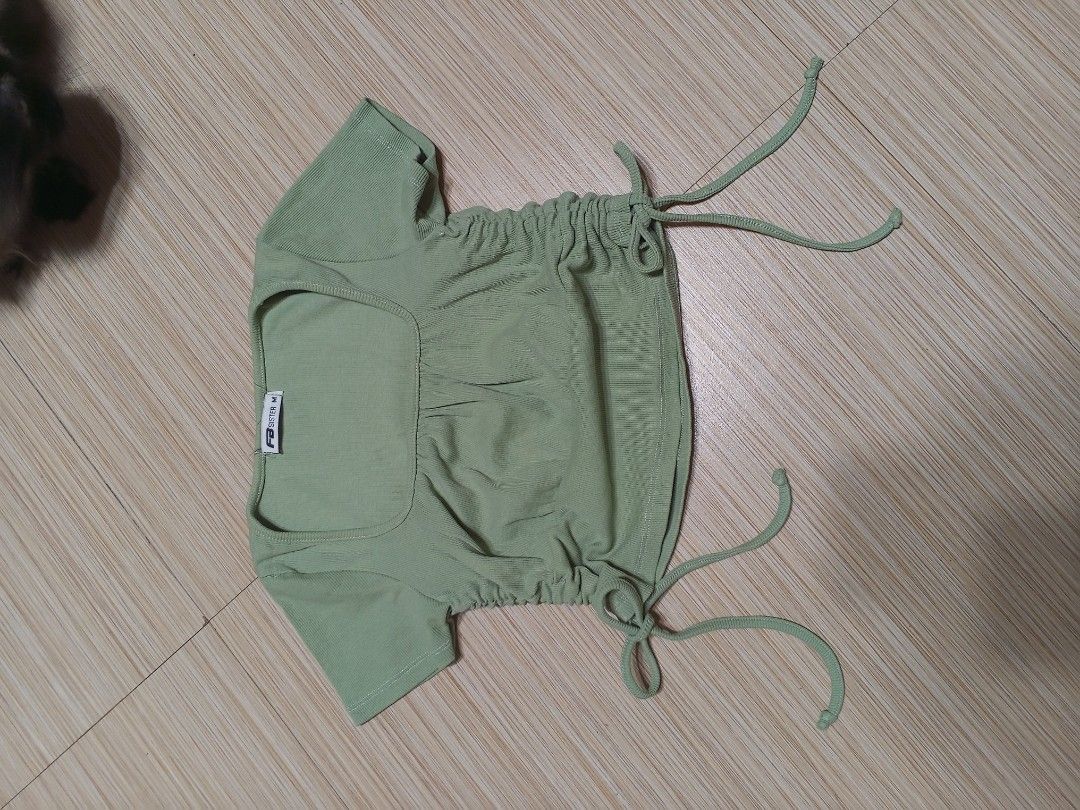 FB Sister Green Ribbed Ruched Crop Top (Category: Others Tops) located in Santa Cruz. Submitted by jldeclutter (Listing ID 1466497321, Image 3). Description: - Size: M on tag but fits me perfectly (size small) Green, stretchy ribbed fabric, square neckline, and adjustable side drawstrings - Condition: Clean and ready to wear Loc: Sta. Cruz, Laguna MOP: GCash MOD: JnT.