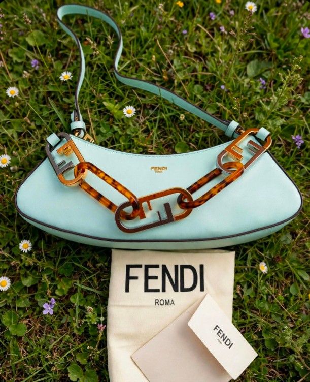 FENDI❣️ (Category: Luxury Bags & Wallets) located in Danao, Cebu. Submitted by wildbear-27a149 (Listing ID 1457786097, Image 3). Description: This appears to be a light mint green leather Fendi O'Lock Swing shoulder bag featuring a mixed metal and tortoiseshell Plexiglass chain link handle. 📌Very nice promise ❣️ 📌FF underzip 📌with tikita 📌likenew condition.