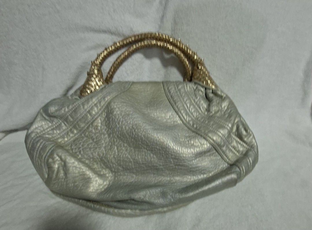 Fendi ( spy bag ) (Category: Tote Bags) located in Manila. Submitted by givesudlyt08 (Listing ID 1466472777, Image 2). Description: authentic fendi spy bag , my personal used , gold and silver , sign of used still head turner.