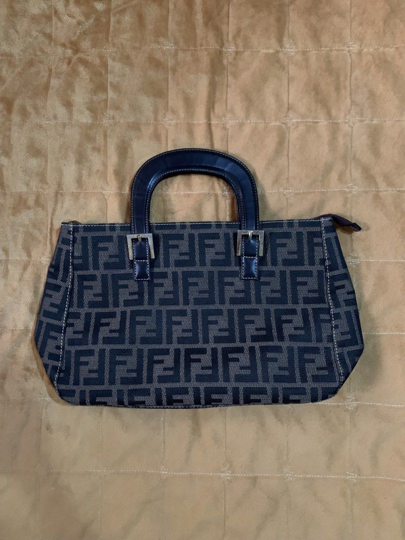 fendi baguette bag/ handbag (Category: Clutches) located in Iloilo. Submitted by arcaine._. (Listing ID 1466418148, Image 3). Description: ~vintage fendi zucchino navy handbag ~dark brown leather top handles ~gold hardware ~open for swap .