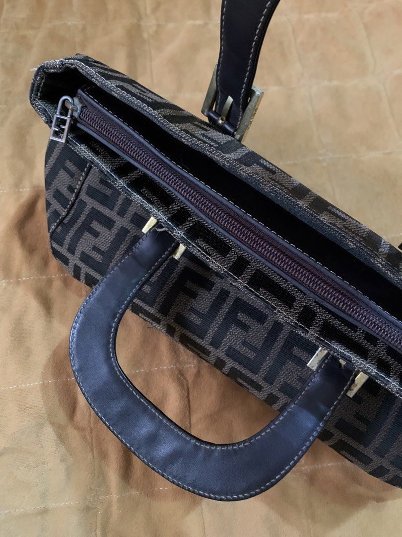 fendi baguette bag/ handbag (Category: Clutches) located in Iloilo. Submitted by arcaine._. (Listing ID 1466418148, Image 1). Description: ~vintage fendi zucchino navy handbag ~dark brown leather top handles ~gold hardware ~open for swap .