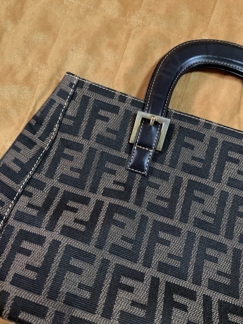 fendi baguette bag/ handbag (Category: Clutches) located in Iloilo. Submitted by arcaine._. (Listing ID 1466418148, Image 2). Description: ~vintage fendi zucchino navy handbag ~dark brown leather top handles ~gold hardware ~open for swap .