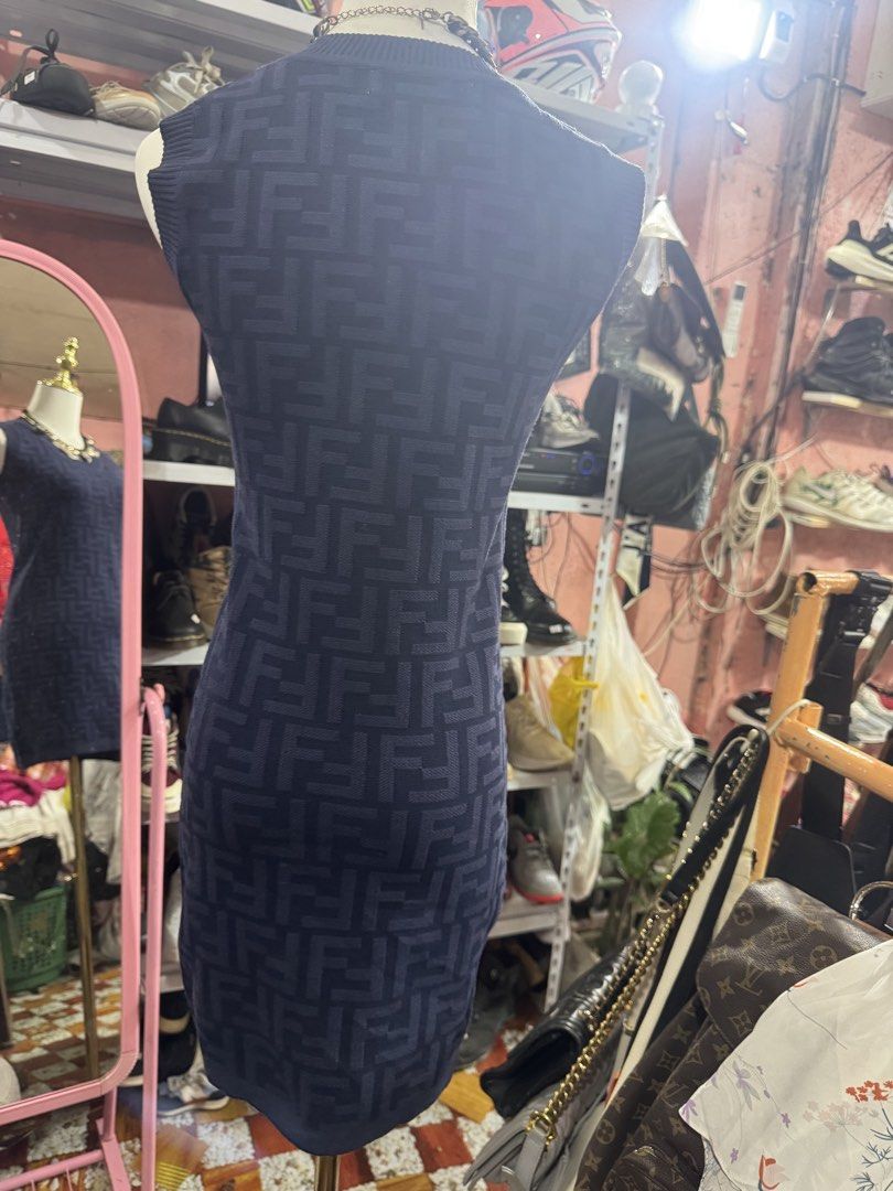 Fendi Dress (Category: Dresses) located in Manila. Submitted by wildbear.e10374 (Listing ID 1466422190, Image 2). Description: - Brand: Fendi - Color: Navy blue with iconic FF logo knit pattern - Style: Sleeveless, scoop neckline, fitted silhouette - Details: Ribbed trim at collar and armholes, branded Fendi Roma interior label - Material: Stretchy, high-quality knit fabric - Condition: Excellent pre-loved condition (ready to wear) - Shipping: Sh