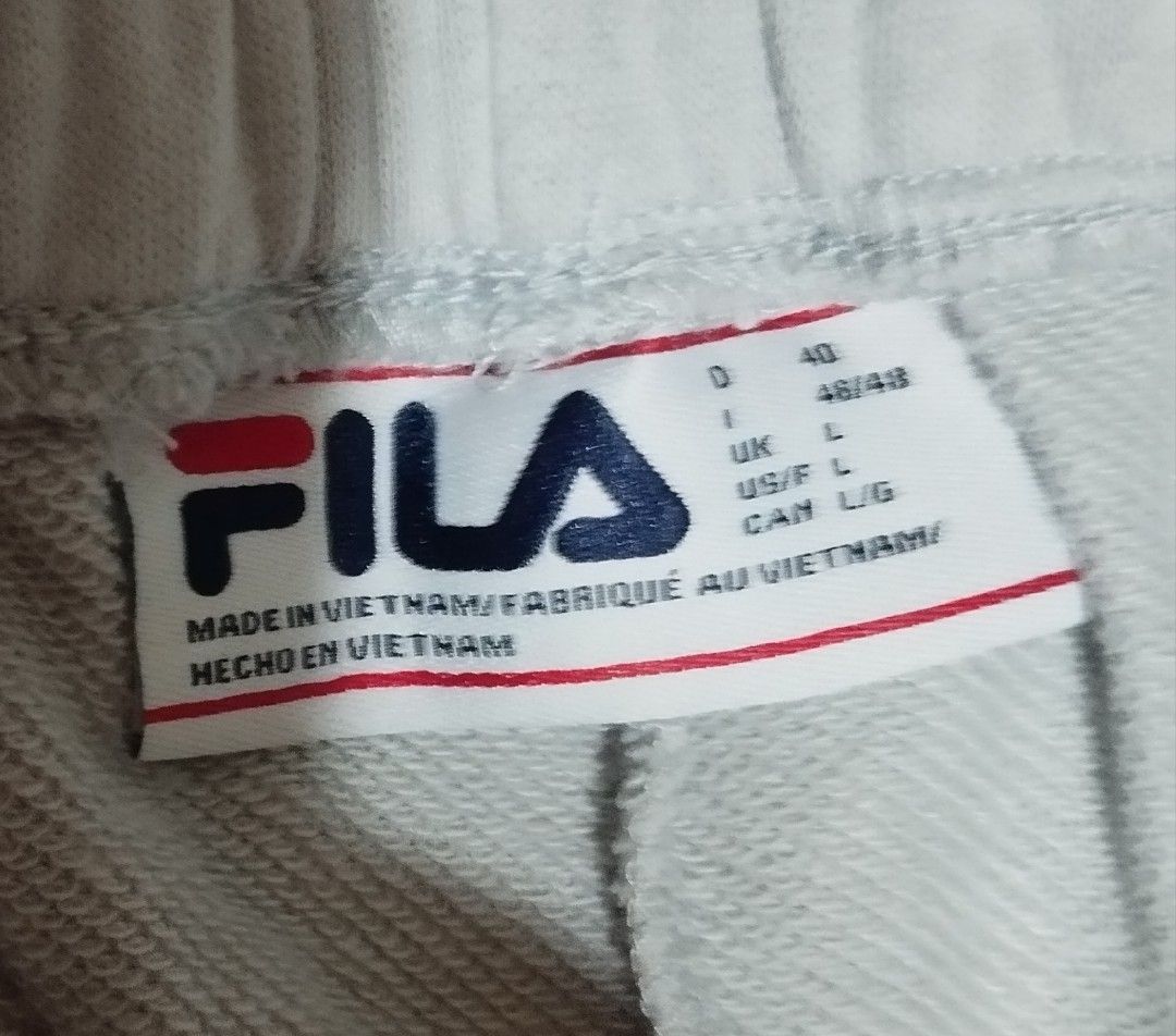 Fila grey joggers sweatpants size L (Category: Joggers) located in Manila. Submitted by lene48 (Listing ID 1466400430, Image 2). Description: - Brand: Fila - Size: Large - Color: Grey - Material: Comfortable cotton blend, made in Vietnam - Features: Elastic waistband, side pockets, and ribbed ankle cuffs - Logo: Subtle Fila logo on the left thigh - Ideal for: Everyday wear, lounging, and running errands.