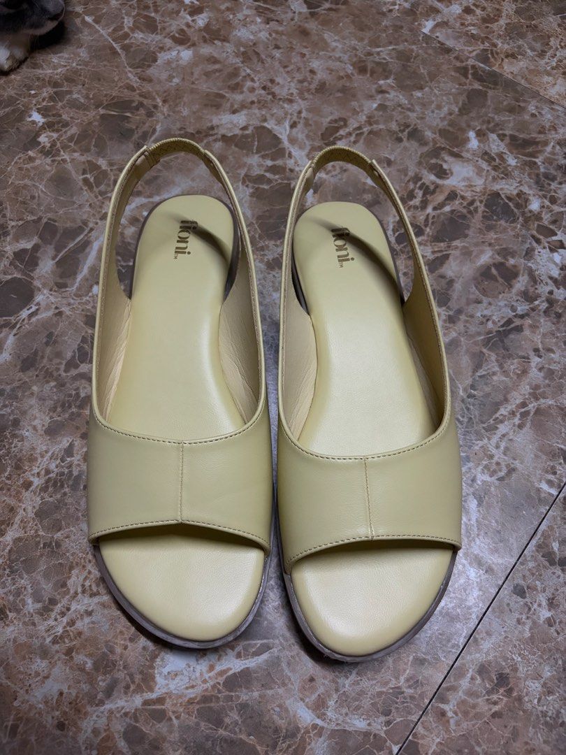 Fioni yellow slingback sandals (Category: Flats & Sandals) located in Bacoor. Submitted by jblns (Listing ID 1466442445, Image 1). Description: Yellow slingback sandals from Fioni. Open toe style flats. Soft foot bed. Used twice..