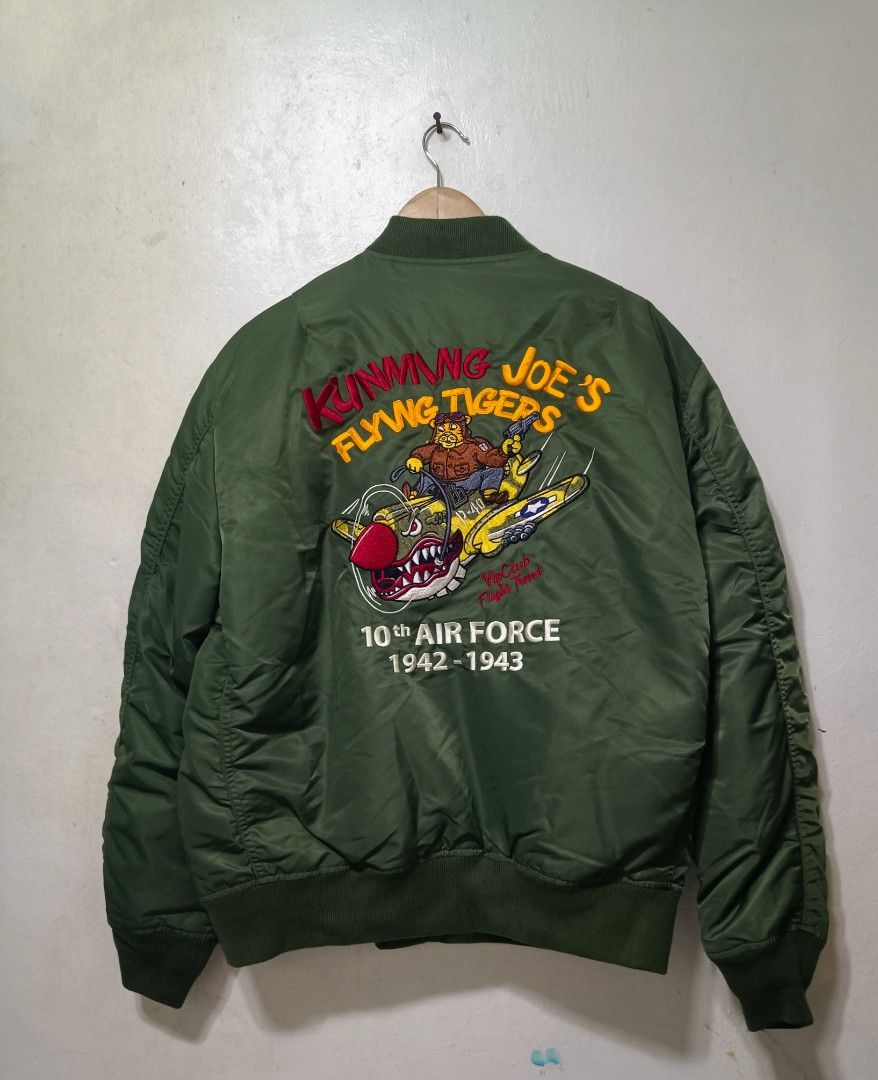 Flight bomber jacket (Category: Coats, Jackets and Outerwear) located in Muntinlupa City. Submitted by kamiseta01 (Listing ID 1466400592, Image 3). Description: authentic MA-1 INTERMEDIATE BOMBER JACKET LARGE OLIVE DRAB BRAND NEW CONDITION The jacket shown in the image is an MA-1 flight bomber jacket featuring military-themed embroidery and patches inspired by the historic 1942–1943 10th Air Force "Flying Tigers" units stationed in Kunming, China