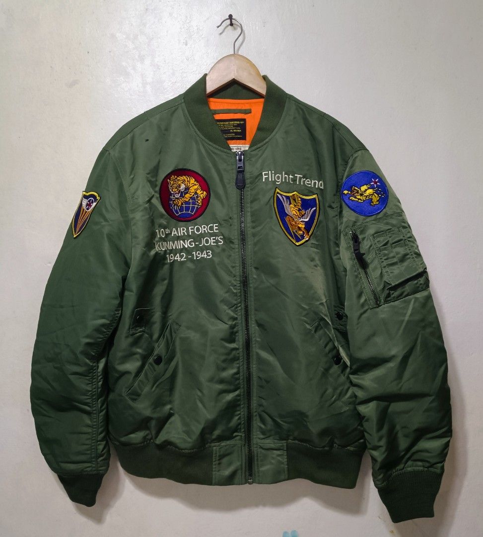 Flight bomber jacket (Category: Coats, Jackets and Outerwear) located in Muntinlupa City. Submitted by kamiseta01 (Listing ID 1466400592, Image 2). Description: authentic MA-1 INTERMEDIATE BOMBER JACKET LARGE OLIVE DRAB BRAND NEW CONDITION The jacket shown in the image is an MA-1 flight bomber jacket featuring military-themed embroidery and patches inspired by the historic 1942–1943 10th Air Force "Flying Tigers" units stationed in Kunming, China