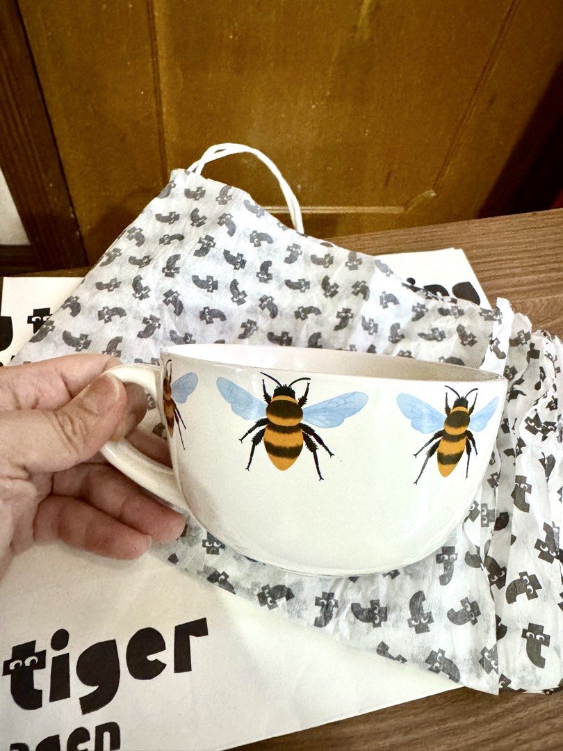 Flying Tiger Copenhagen Bee Mug Bowl (Category: Coffee & Tea Tableware) located in Quezon City. Submitted by appplebananna (Listing ID 1466476937, Image 3). Description: - Authentic Flying Tiger Copenhagen large ceramic mug bowl - Adorable bumblebee design with blue wings and black-yellow stripes all around - Large, ergonomic handle for a comfortable and easy grip - Comes with the original Flying Tiger store bag, perfect for gifting.