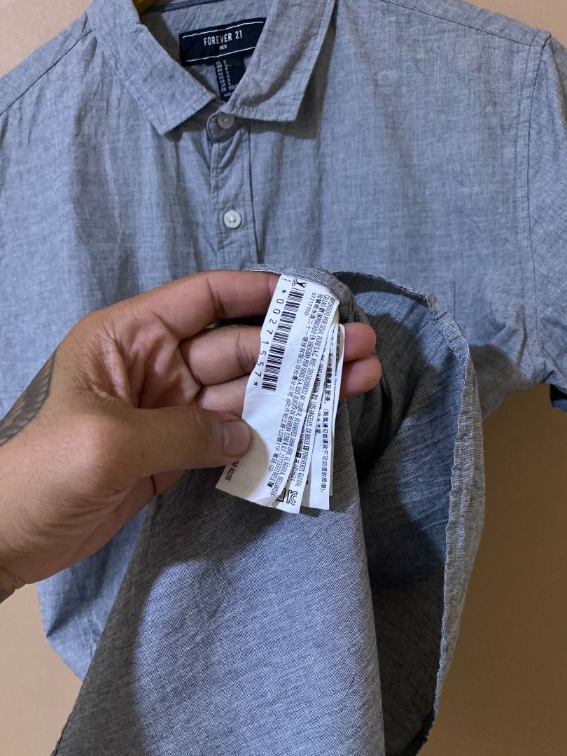Forever 21 Grey Button Up Polo (Category: Tshirts & Polo Shirts ) located in Cadiz. Submitted by davidspothead (Listing ID 1466348592, Image 3). Description: Small on tag Width 19" Length 28.5" Good as new.