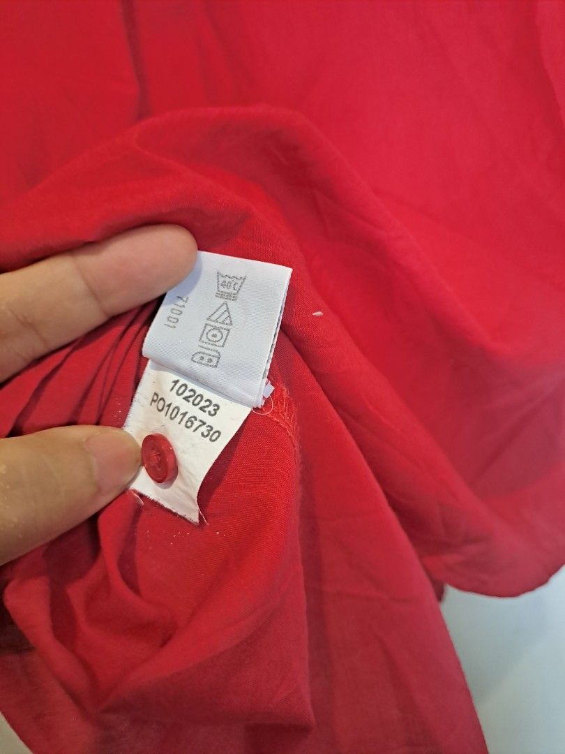 Fox crop red longsleve (Category: Longsleeves) located in Manila. Submitted by joanbalde39643 (Listing ID 1466438540, Image 3). Description: This item is a Foxcroft wrinkle-free button-down shirt in a vibrant solid red hue. It features a classic pointed collar, a button-up front, and practical 3/4-length sleeves with cuff details. Made from a signature low-maintenance cotton blend fabric, this tailored top is highly regarded for maintaining a cri