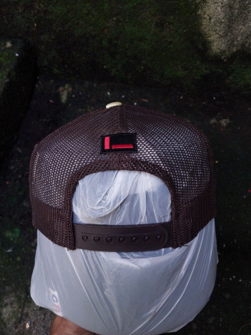 FUBU Original Quilted Trucker Cap Brown Gold (Category: Caps & Hats) located in Sorsogon. Submitted by Gthrift420 (Listing ID 1466450287, Image 2). Description: - 100% Authentic FUBU The Collection trucker cap - Gold quilted front panel with red embroidery and rhinestone details - Brown mesh back for breathability and comfort - Adjustable snapback closure for a custom fit - Made in Korea with official interior tags and serial number F-C.09205.