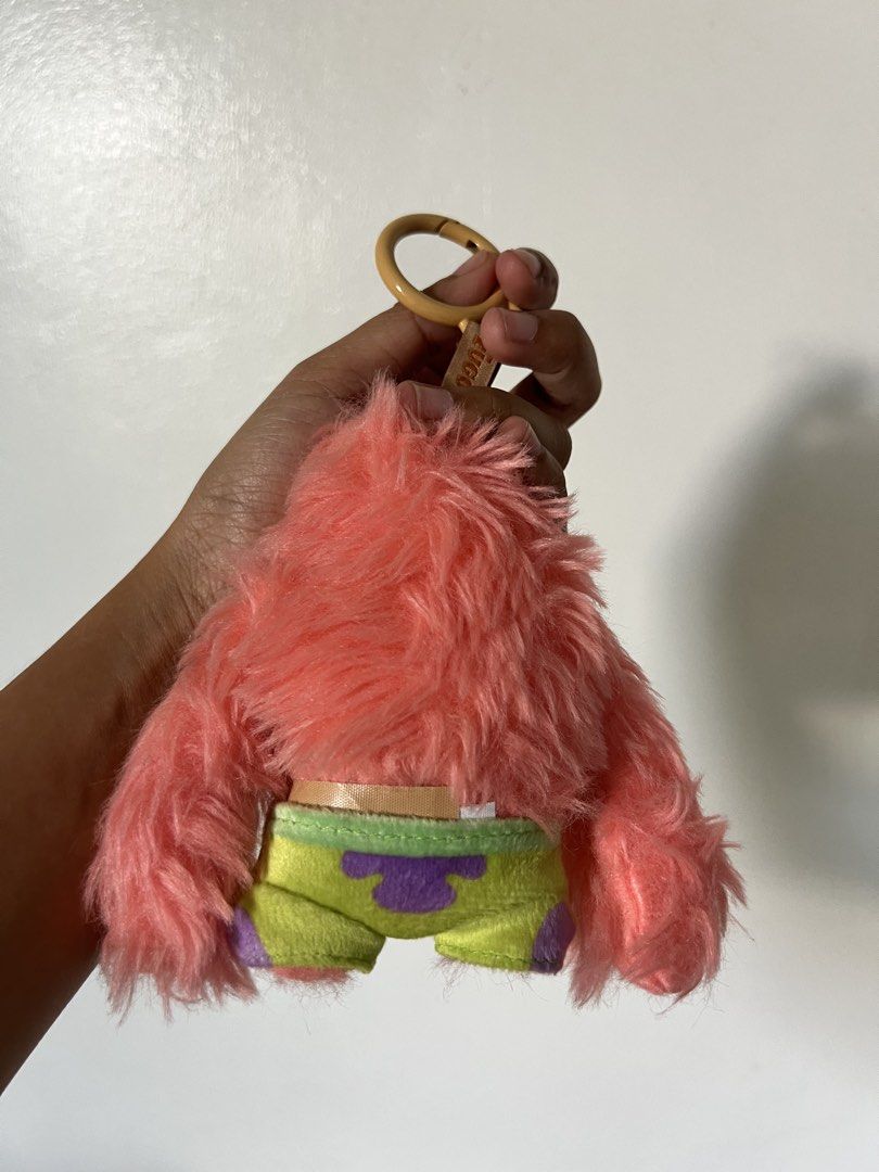 Fugglers SpongeBob SquarePants Patrick Star Plush Keychain (Category: Plushies & Soft Toys) located in Quezon City. Submitted by declutteringpeppers (Listing ID 1466422174, Image 2). Description: - Character: Patrick Star from SpongeBob SquarePants - Brand: Authentic Fugglers plush keychain - Design: Pink hairy body, sleepy eyes, and green patterned shorts - Features: Attached top loop ring with official branded Fugglers tag - Condition: Brand ne