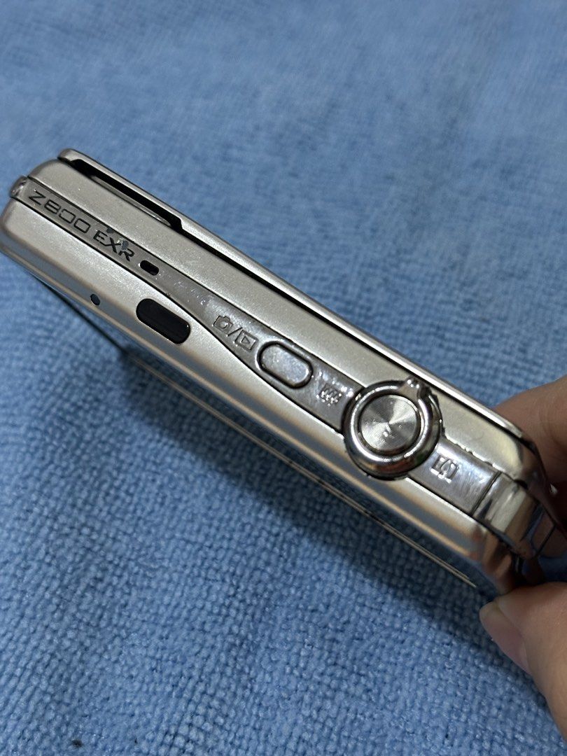 Fujifilm FinePix Z800EXR Digital Camera (Category: Cameras) located in Makati City. Submitted by keitherz (Listing ID 1466480607, Image 2). Description: Fujifilm FinePix Z800EXR Specs: - Ultra-compact - 12 Megapixels EXR CCD Sensor - 5x Optical Zoom - 3.5” LCD Screen - 720p Video Inclusions: - Camera - 4GB SanDisk SD Card - 2 Batteries - Battery Charger - Generic Hard Shell Pouch Has minor scratches and signs of use. RFS: Vet bills.