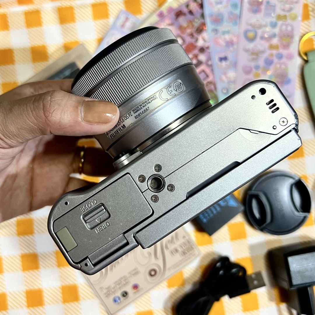 Fujifilm XA20 Mirrorless Camera (Category: Cameras) located in Makati City. Submitted by CameraHubPH (Listing ID 1466432748, Image 3). Description: 🎀 FUJIFILM X-A20 MIRRORLESS CAMERA 🎀 𐙚 ONE OF FUJIFILM’S UNDERRATED GEMS 𐙚 ✨ CAMERA DETAILS ✨ ♡ Fujifilm X-A20 Mirrorless ♡ XC 15-45mm OIS PZ Kit Lens ♡ Crisp & detailed image quality ♡ Built-in flash — working perfectly ⚡️ ♡ Autofocus working ♡ Zoom working ♡ LCD screen working ♡ Takes photos & v