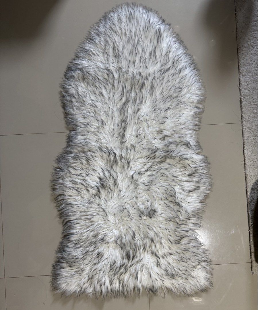 fur rug (Category: Carpets, Mats & Flooring) located in Cagayan de Oro. Submitted by serenexsienna (Listing ID 1466523361, Image 1). Description: ✅Faux Fur Fluffy Rug White Grey ✅Used once for pictorial ✅Fluffy faux fur rug in a mix of white and dark grey tips. Soft plush texture, thick pile ✅Long runner shape with curved ends. Great size for placement beside the bed, living room floor, or draped over a chair. ✅Clean condition overall, minimal si