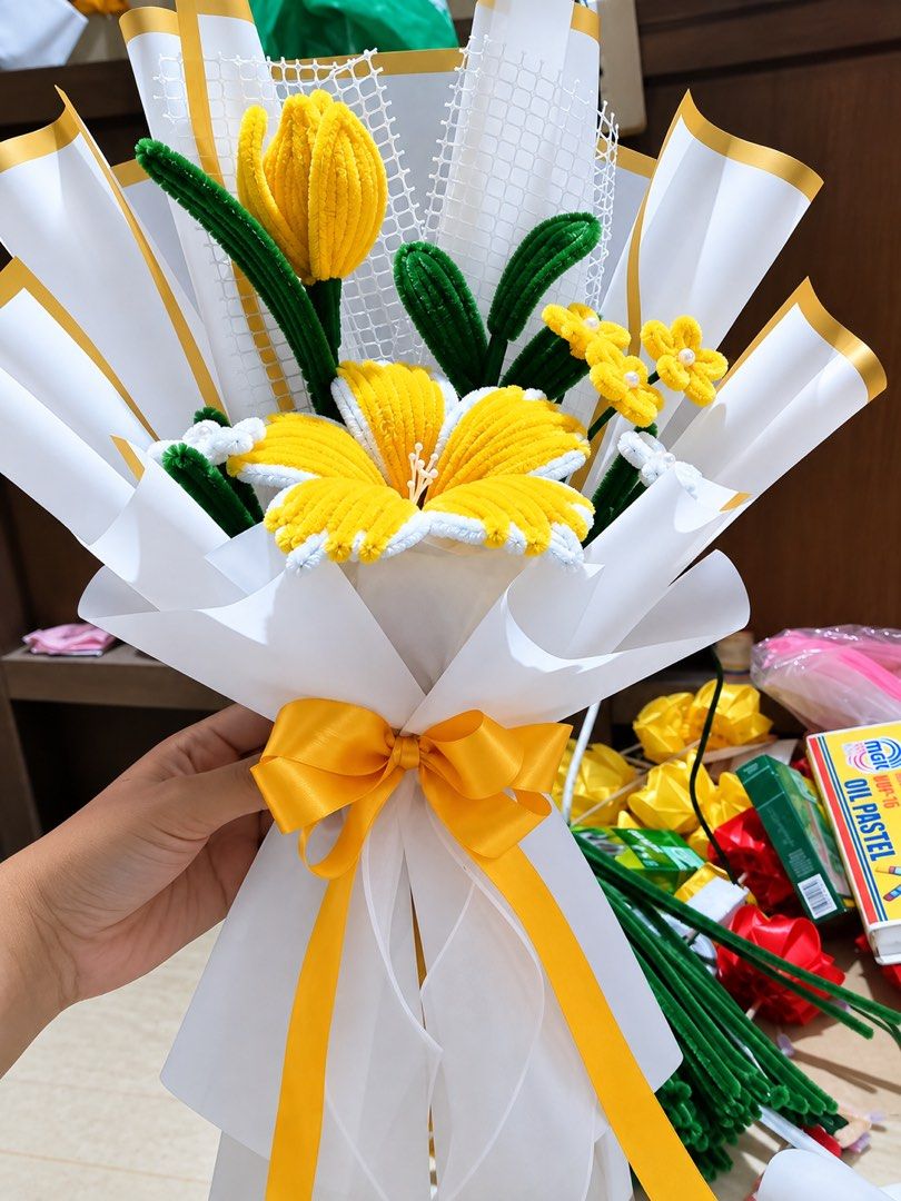 Fuzzy Wire Flower Bouquet (Category: Flowers & Bouquets) located in Bacoor. Submitted by owenjii (Listing ID 1466537775, Image 1). Description: - Handmade pipe cleaner floral arrangement - Includes a large centerpiece flower, a tulip, accent flowers, and green leaves - Elegantly wrapped in decorative paper with a matching satin bow - Ideal gift for birthdays, graduations, anniversaries, and other special occasions - Available in clean, vibrant co