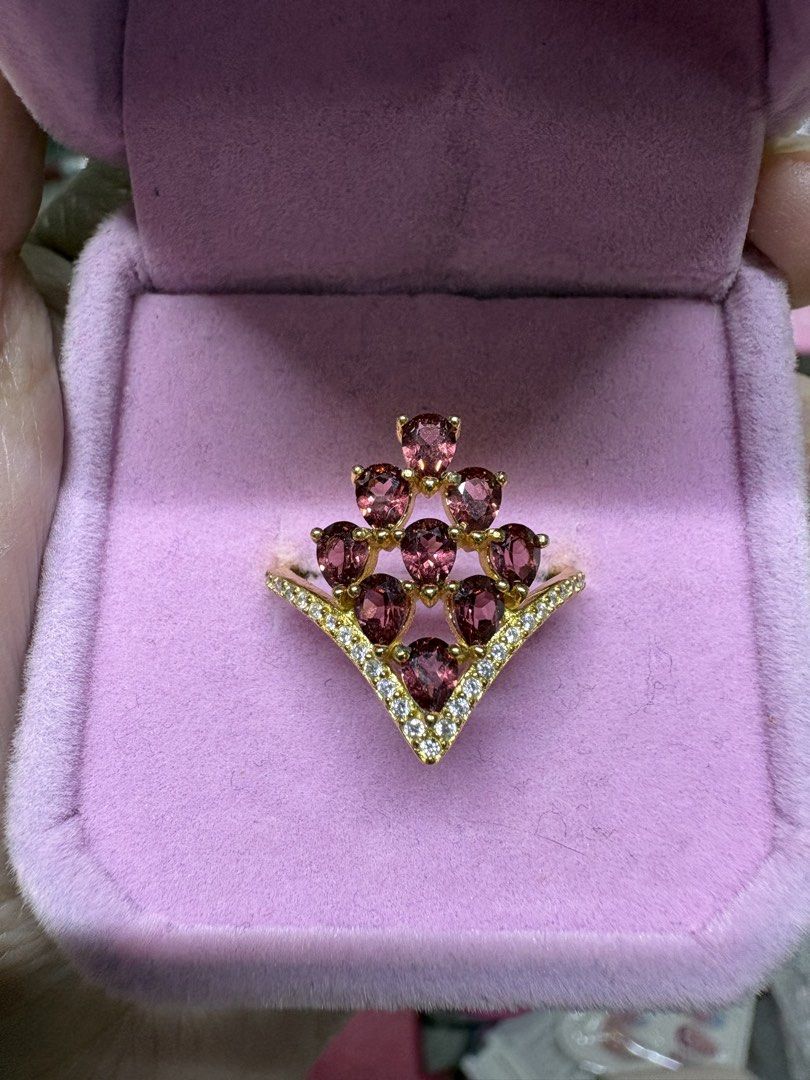 Natural Garnet V-Shape Cluster Ring S925 (Category: Rings) located in Manila. Submitted by alyannaros79007 (Listing ID 1466475140, Image 2). Description: Garnet cluster ring in S925 silver with gold plating. Faceted pear-cut purple-red stones arranged in a pyramid shape. Band detailed with tiny pavé diamonds in a V-shaped chevron design. Total weight 2.17 grams. Comes with testing certificate card..