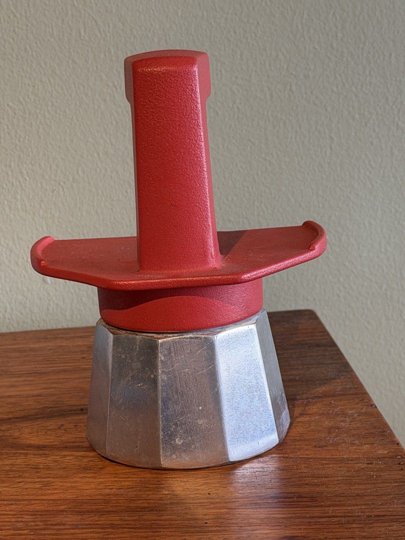 Gemini Express Italy Moka Pot Red Silver Espresso Maker (Category: Coffee Machines & Makers) located in Quezon City. Submitted by dailydeclutter (Listing ID 1466398735, Image 2). Description: Got this from the MOMA store in New York Brand: Gemini Express Italy - Color: Red top handle/base with silver aluminum boiler - Type: Classic stovetop espresso maker - Condition: Bottom shows some wear and discoloration from normal use; numbered stamp on the