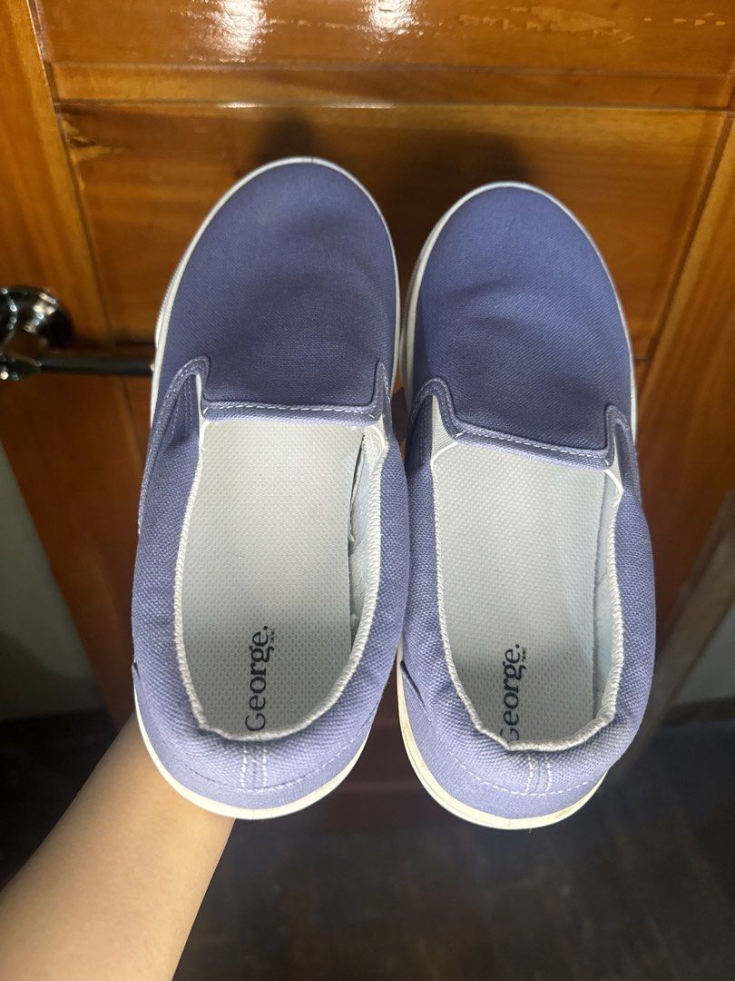 George Blue Canvas Slip-On Shoes (Category: Casual Shoes) located in Baguio. Submitted by heath2600 (Listing ID 1466452955, Image 1). Description: - Brand/Model: George canvas slip-on shoes - Color: Nice blue shade with matching blue trim on white rubber soles - Condition: Clean, hardly worn (like new) - Style: Easy casual wear - Best for: Everyday errands or hanging out.