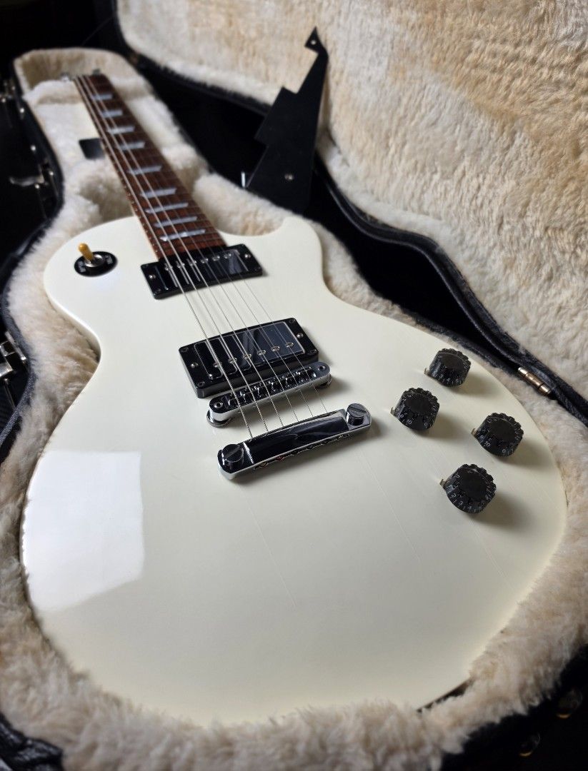 Gibson Les Paul Studio High performance in Alpine white - All stock electronics push/pull feature (Category: Musical Instruments) located in Manila. Submitted by jbbcollectio (Listing ID 1466462536, Image 1). Description: All stock electronics Excellent fret life, minimal to no fret wear Tuners upgraded to Grover tulip tuners This version has the push and pull function for single coil and humbucker tone In Rare Alpine white finish Original Gibson