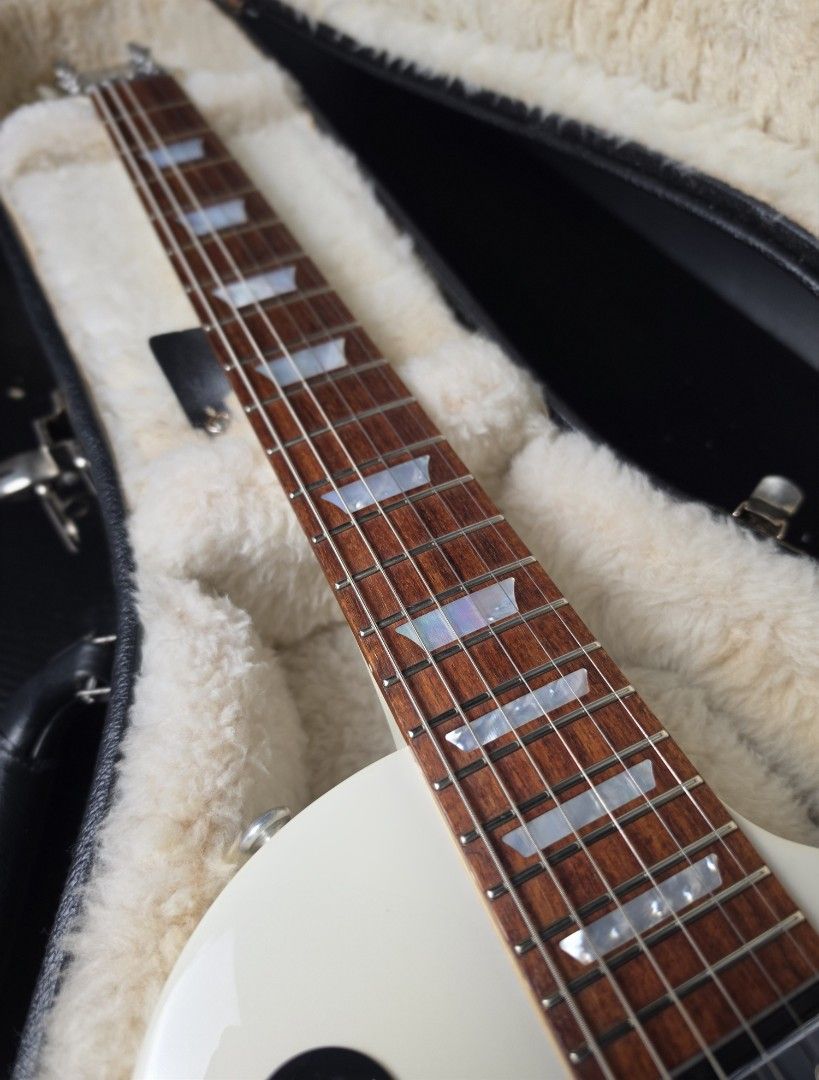 Gibson Les Paul Studio High performance in Alpine white - All stock electronics push/pull feature (Category: Musical Instruments) located in Manila. Submitted by jbbcollectio (Listing ID 1466462536, Image 2). Description: All stock electronics Excellent fret life, minimal to no fret wear Tuners upgraded to Grover tulip tuners This version has the push and pull function for single coil and humbucker tone In Rare Alpine white finish Original Gibson