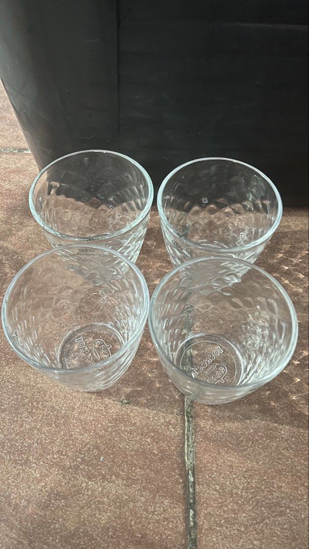 Glass cups and saucers set (Category: Coffee & Tea Tableware) located in Manila. Submitted by ayessaset53754 (Listing ID 1466378470, Image 1). Description: - Elegant matching set: honeycomb-textured clear glass cups with Alfonso I branding, swirl pattern cups, and ribbed glass saucers - Versatile and stylish: perfect for serving coffee or tea when hosting guests - Durable and practical: made with sturdy glassware that is very easy to wash - Reaso