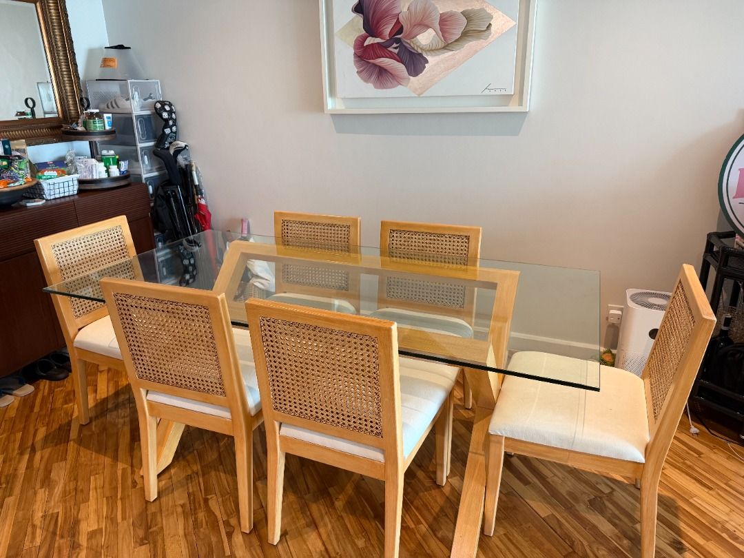 Glass Dining Table and Six Chairs with Rattan Design (Category: Tables & Sets) located in Makati City. Submitted by peeveeimperial (Listing ID 1466480089, Image 1). Description: - Rectangular glass top dining table with light wooden base - Includes 6 matching chairs with rattan backrests and white leather upholstered cushions - Clean, modern design that fits most dining spaces comfortably - Removable glass top for easier transport and moving - We
