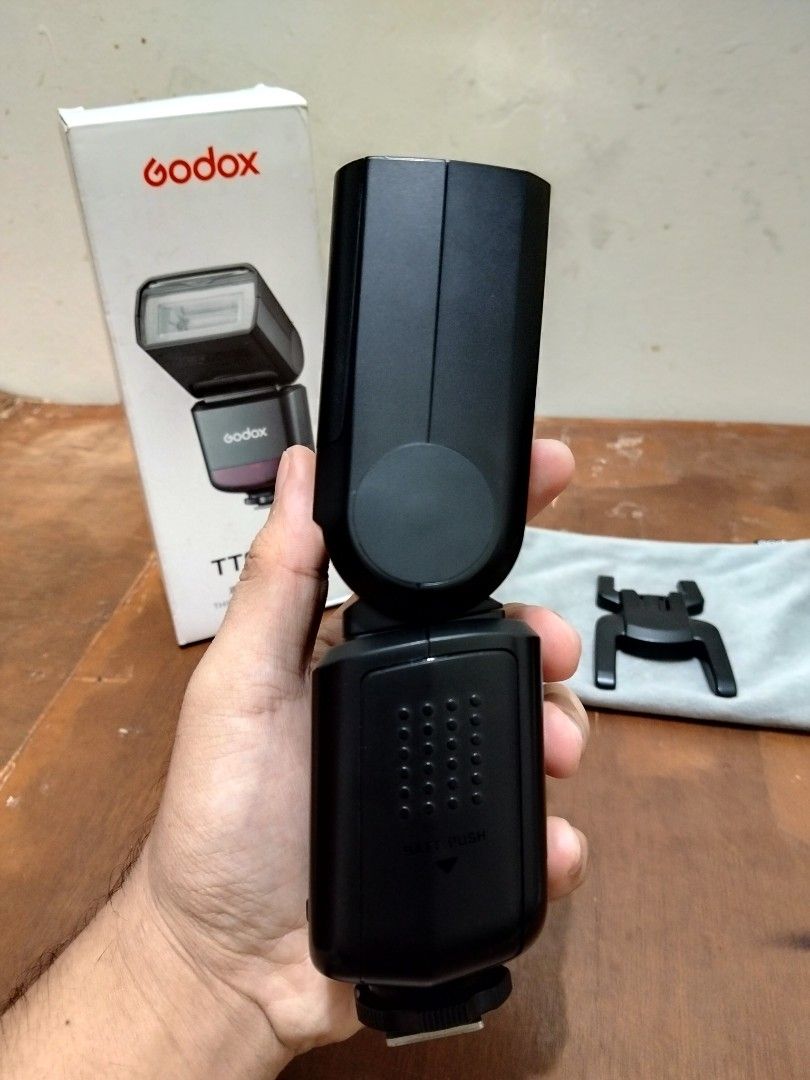 Godox Thinklite TTS20 III Camera Flash (Category: Flashes) located in Manila. Submitted by flx.zkl (Listing ID 1466515646, Image 3). Description: - Model: Godox Thinklite TTS20 III camera flash unit (Black) - Minor scratches - Condition: Fully functional, box shows minor handling wear - Power Source: Runs on standard AA batteries - Includes: Original retail box, mini flash stand, storage pouch, and wireless trigger - Perfect for portable and stud