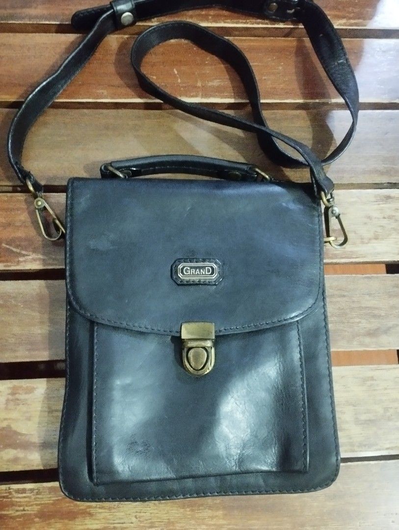Grand Leather Bag (Category: Sling Bags) located in San Fernando. Submitted by nerosales (Listing ID 1466398342, Image 1). Description: Grand Leather Bag Genuine Leather Collection length - 10 inches width - 8 5 inches side thickness - 4 inches Good condition, solid hardware, walang sira, all zippers working. Kasya ang makasaysayang ba-rel 1,650 pesos only SM City Pampanga Shipping: J&T Payment: Gcash NO COD / NO COP.