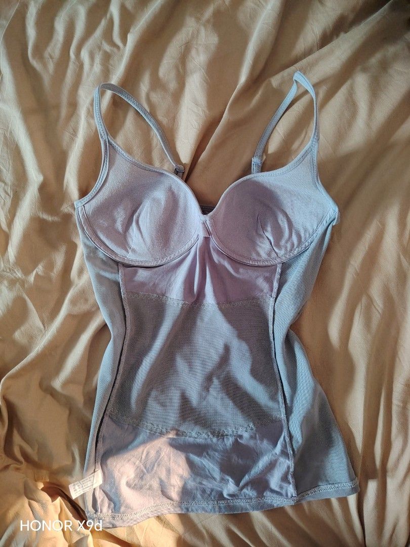 Gray Padded Camisole Shaping Top (Category: Sleeveless) located in Mabalacat. Submitted by Jackikay.PreLoved (Listing ID 1466434010, Image 2). Description: LAKAS MAKA SEXY NITO! Shapewear - Size: XL on tag but fits S-M - Color: Gray /Super light purple - Built-in padded bra cups for extra support - Adjustable straps for a custom fit - Mesh panels at sides and back for breathability - Smooth front panel with subtle contour stitching.