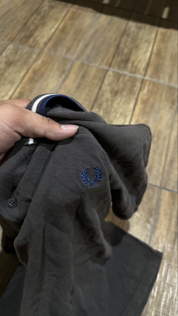 GREY FRED PERRY (Category: Tshirts & Polo Shirts ) located in Manila. Submitted by urban.vintage (Listing ID 1466452241, Image 2). Description: ISSUE : NONE( NEED WASH ) MOP :GCASH ( NO COD ) SHIP VIA : LALAMOVE & J&T LOCATION : PASIG CITY LENGTH : 26 WIDTH : 23.