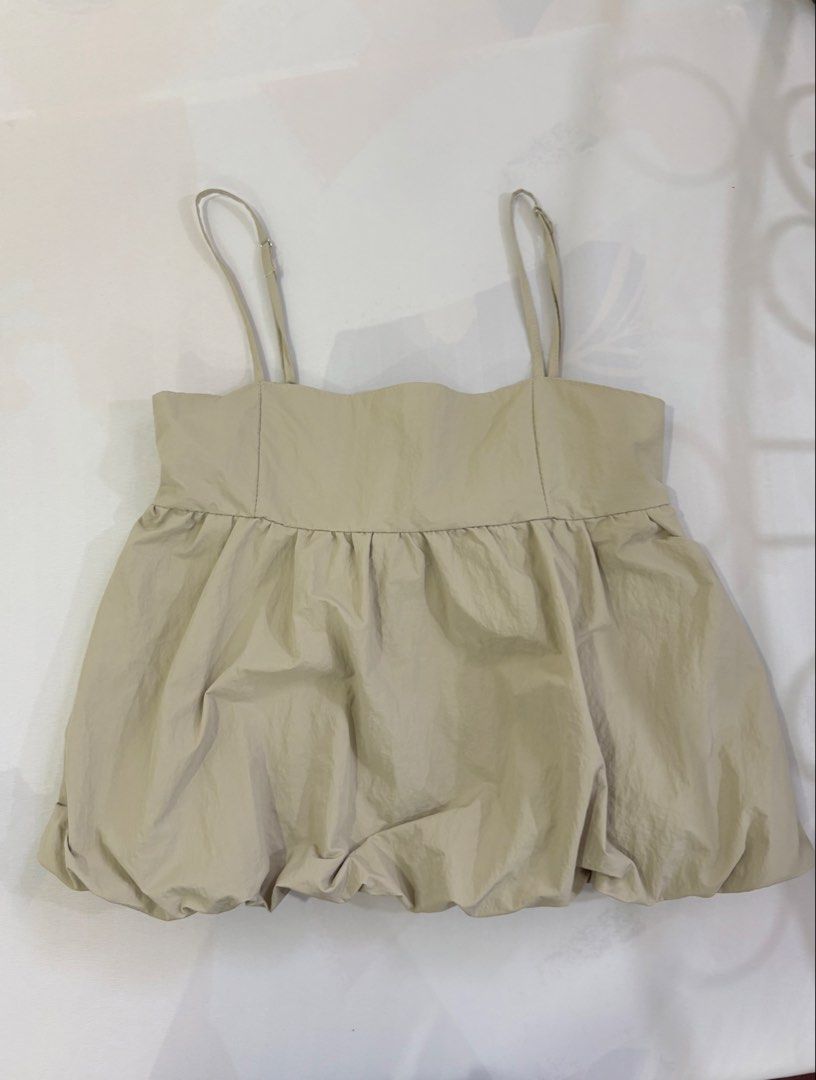 GU beige bubble hem camisole top (Category: Blouses) located in Quezon City. Submitted by pinkpaloma (Listing ID 1466396667, Image 3). Description: 🎐 Large but fits well w small rin 🎐 Bought for P700 🎐 Never been worn 🎐 May minor flaw Location: Commonwealth, Quezon City Mode of Payment: GCash or Maya Mode of Delivery: Grab, Lalamove, Gogoxpress ⭐️ Shipping fee shouldered by buyer .