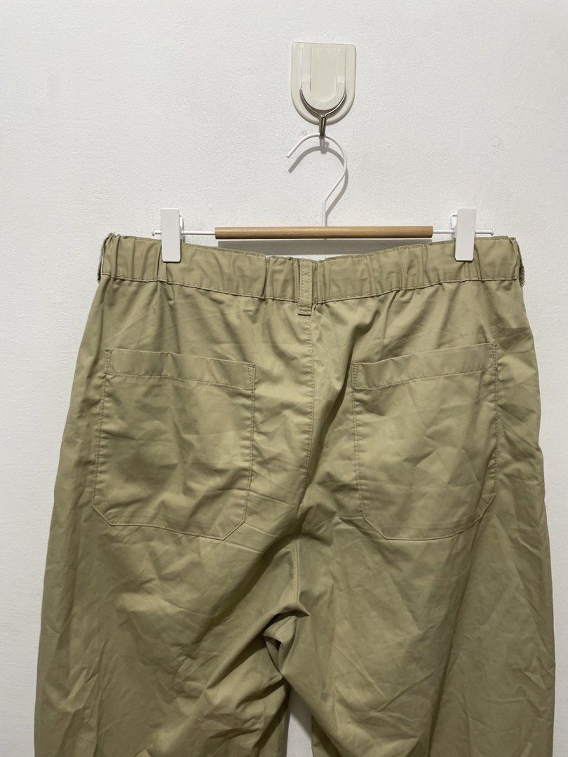 GU Beige Wide Fit pants Size M (Category: Trousers) located in Makati City. Submitted by nicolettel27186 (Listing ID 1466517141, Image 3). Description: - Brand/Style: GU casual pants - Color: Khaki beige - Size: Medium (tag inside) - Details: Pleated front, button closure, zipper fly, built-in drawstring waist - Pockets: Two back pockets - Condition: Clean fabric overall.