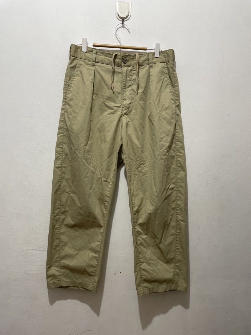 GU Beige Wide Fit pants Size M (Category: Trousers) located in Makati City. Submitted by nicolettel27186 (Listing ID 1466517141, Image 1). Description: - Brand/Style: GU casual pants - Color: Khaki beige - Size: Medium (tag inside) - Details: Pleated front, button closure, zipper fly, built-in drawstring waist - Pockets: Two back pockets - Condition: Clean fabric overall.