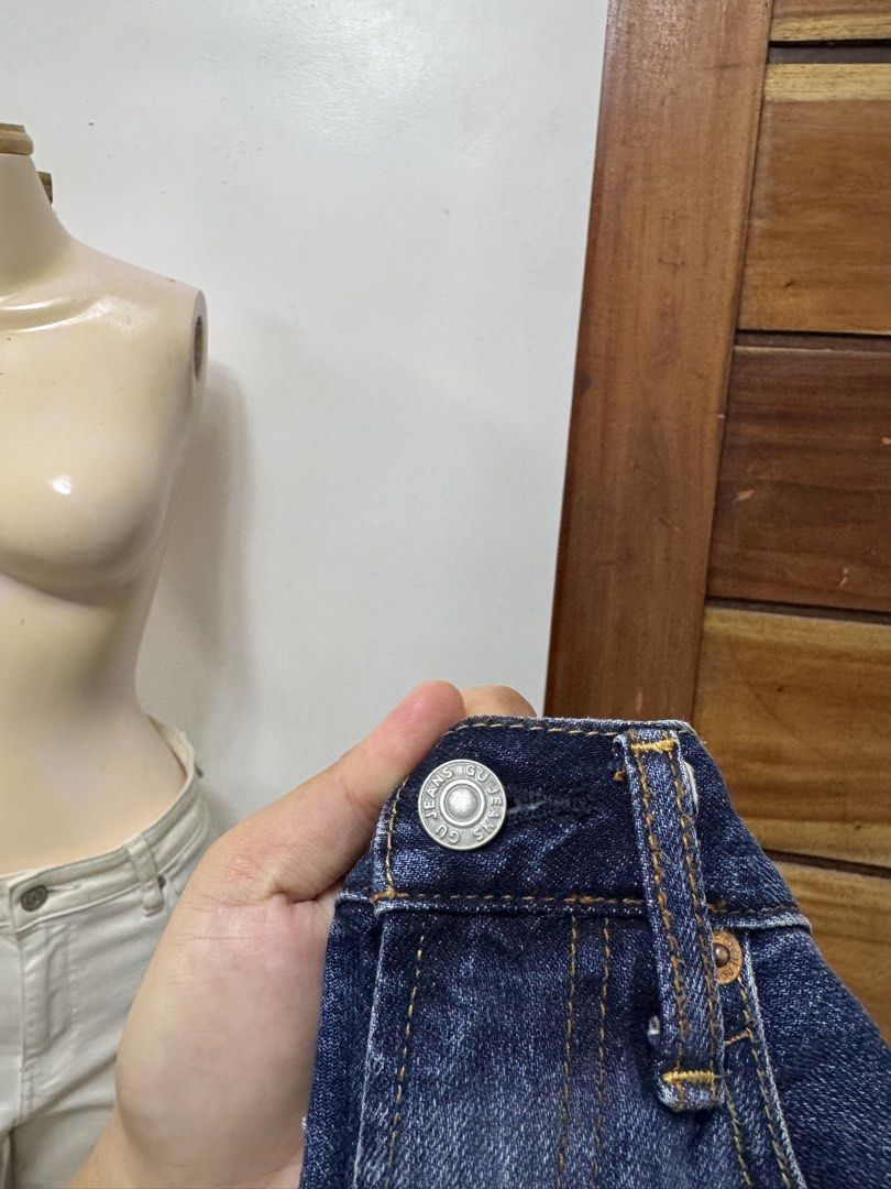 GU Dark Wash Denim Jeans (Category: Jeans) located in Cavite. Submitted by yakultjeni85475 (Listing ID 1466477575, Image 2). Description: - Brand: GU - Style: Straight fit / Straight leg - Color: Classic dark blue wash - Closure: Standard button and zip fly - Design: Five-pocket with contrast stitching - Condition: Clean, no heavy fading or stains - Size: Tagged size inside.