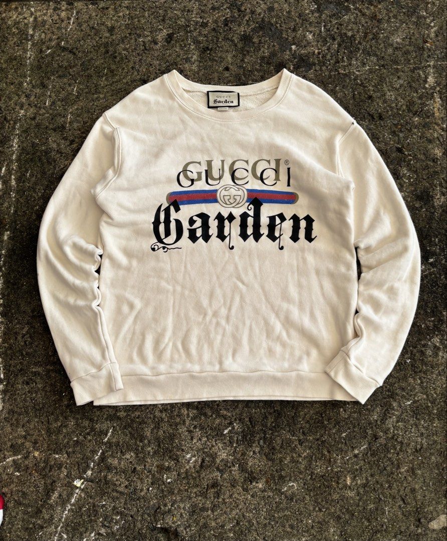 Gucci Garden Off-White Sweatshirt (Category: Coats, Jackets and Outerwear) located in Caloocan City. Submitted by neweagle-424b (Listing ID 1466391077, Image 1). Description: Dimes : W 21 -22 x 27 L - Brand: Gucci Garden - Color: Off-white - Design: Large chest graphic with iconic web stripe and interlocking G logo - Style: Classic crewneck with ribbed cuffs and hem - Material: Soft cotton loopback jersey - wOrigin: Made in Italy - tags and care 