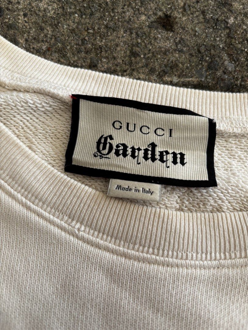 Gucci Garden Off-White Sweatshirt (Category: Coats, Jackets and Outerwear) located in Caloocan City. Submitted by neweagle-424b (Listing ID 1466391077, Image 3). Description: Dimes : W 21 -22 x 27 L - Brand: Gucci Garden - Color: Off-white - Design: Large chest graphic with iconic web stripe and interlocking G logo - Style: Classic crewneck with ribbed cuffs and hem - Material: Soft cotton loopback jersey - wOrigin: Made in Italy - tags and care 