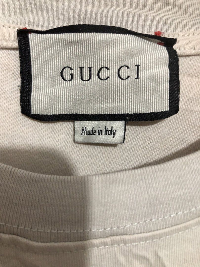 Gucci Interlocking G Stripe T-shirt Size M (Category: Tshirts & Polo Shirts ) located in Quezon City. Submitted by clarizedeo09960 (Listing ID 1466499109, Image 2). Description: - Brand: Gucci - Color: Off-white - Size: Medium (regular fit) - Material: Comfortable cotton (Made in Italy) - Design: Classic stripe chest band with interlocking G logo - Condition/Details: Neck tag and wash label attached - Style: Easy streetwear piece.
